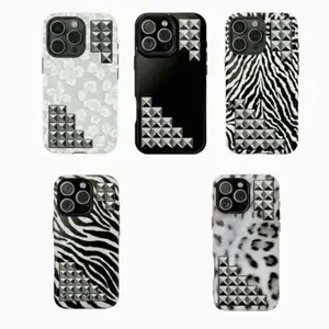 The phone case has a snow leopard print theme with 11-17 rhinestones
