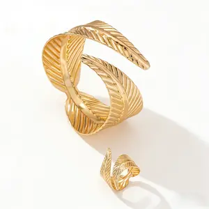 Elegant Gold Feather Textured Cuff Bracelet and Ring Set Nature Inspired Detailed Leaf Pattern Sophisticated Accessory Set for Fashion Enthusiasts and Formal Occasions Cross Necklace Surgical Steel Stud Earrings Mesh Water Drop Plated tiara Silver