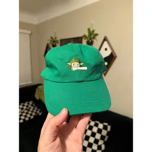 I bite - illustration on kelly green dad hat in 2 colorways