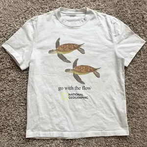 Gildan Men's and Women's T-shirt, National Geographic turtle “go tied the flow” tee, Animal tee, Y2k Unisex Graphic Tees Gothic Grunge Emo Scene Amity Affliction Style Clothes Menswear Womenswear Streetwear