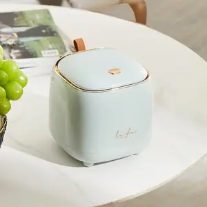 Mini desktop trash bin with lid, oval shape, polished surface, suitable for offices, homes, bedrooms, living rooms, and bathrooms, making it an ideal choice for home and room decoration.