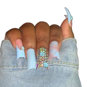 Cotton Candy Baby Blue Acrylic Press on Nail Set with Full Bling, Includes Decorative Elements and a Unique Design