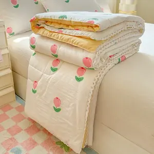 A lightweight summer quilt featuring a lace-trimmed tulip pattern—soft, breathable, Soft Lightweight Quilts, and ideal for use in the bedroom, office, living room, or for general home relaxation during the summer season