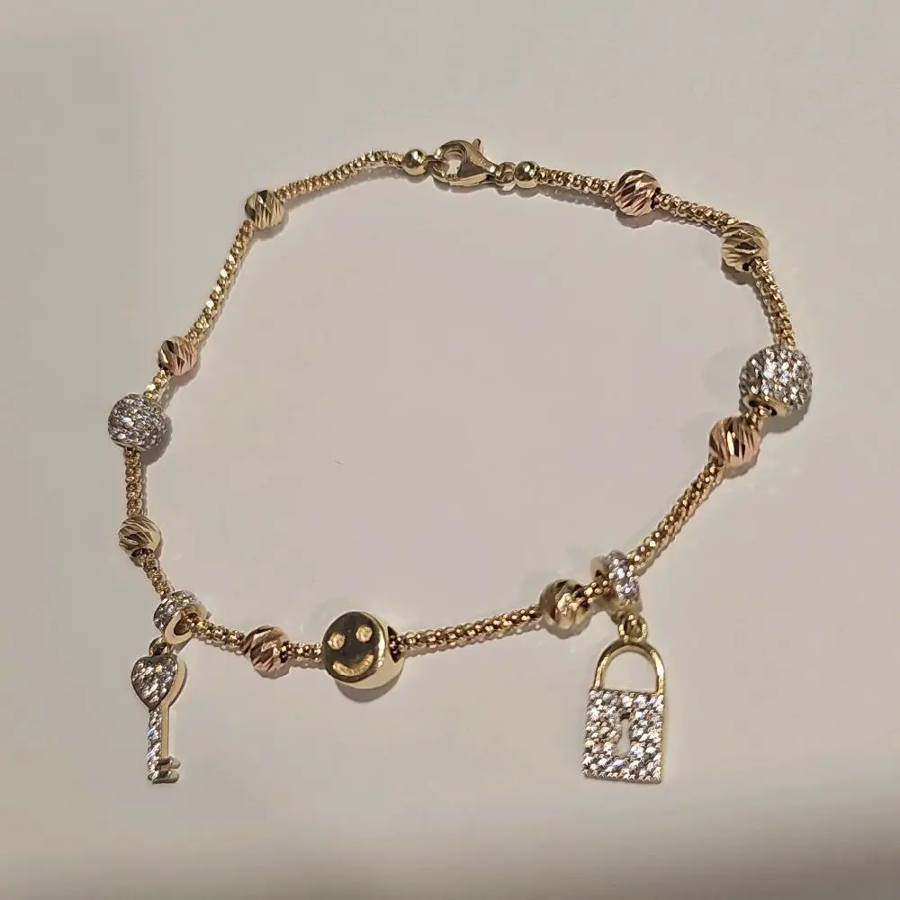 Charm Bracelet in 14k gold with white and rose gold tones