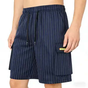 Loose-fit drawstring Bermuda shorts for summer, featuring an American street-style design, trendy patch labels, and a multi-pocket cargo structure. Breathable, wear-resistant, and moisture-wicking—ideal for everyday commuting and streetwear looks. Comfort