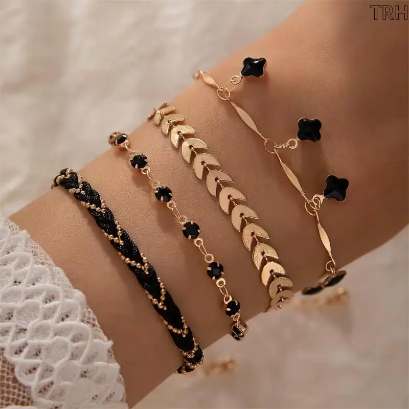 4pcs Gold Tone Clover Charm Bracelet Set, Black & Gold Stackable Bracelets for Women, Dainty Geometric Leaf & Flower Bracelet Pack, Elegant Everyday Jewelry Set