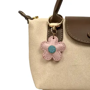 Handmade Two-Tone Waxed Cowhide Five-Petal Flower Bag Charm, Hand saddle stitched vintage leather purse pendant with natural distressed frosted texture, unique color-changing leather accessory for handbag & keychain, ideal daily wear gift for ladies.