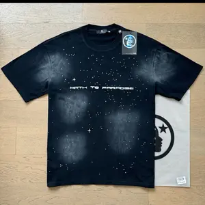 Amari T-Shirt with "Path to Paradise" Design, Black Color, Short Sleeves, Round Neck, Casual Style