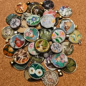 Round dainty pendants, various designs! comes with leather cord!