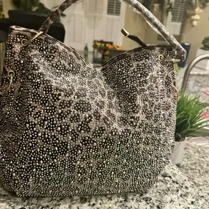 Rhinestone covered leopard handbag