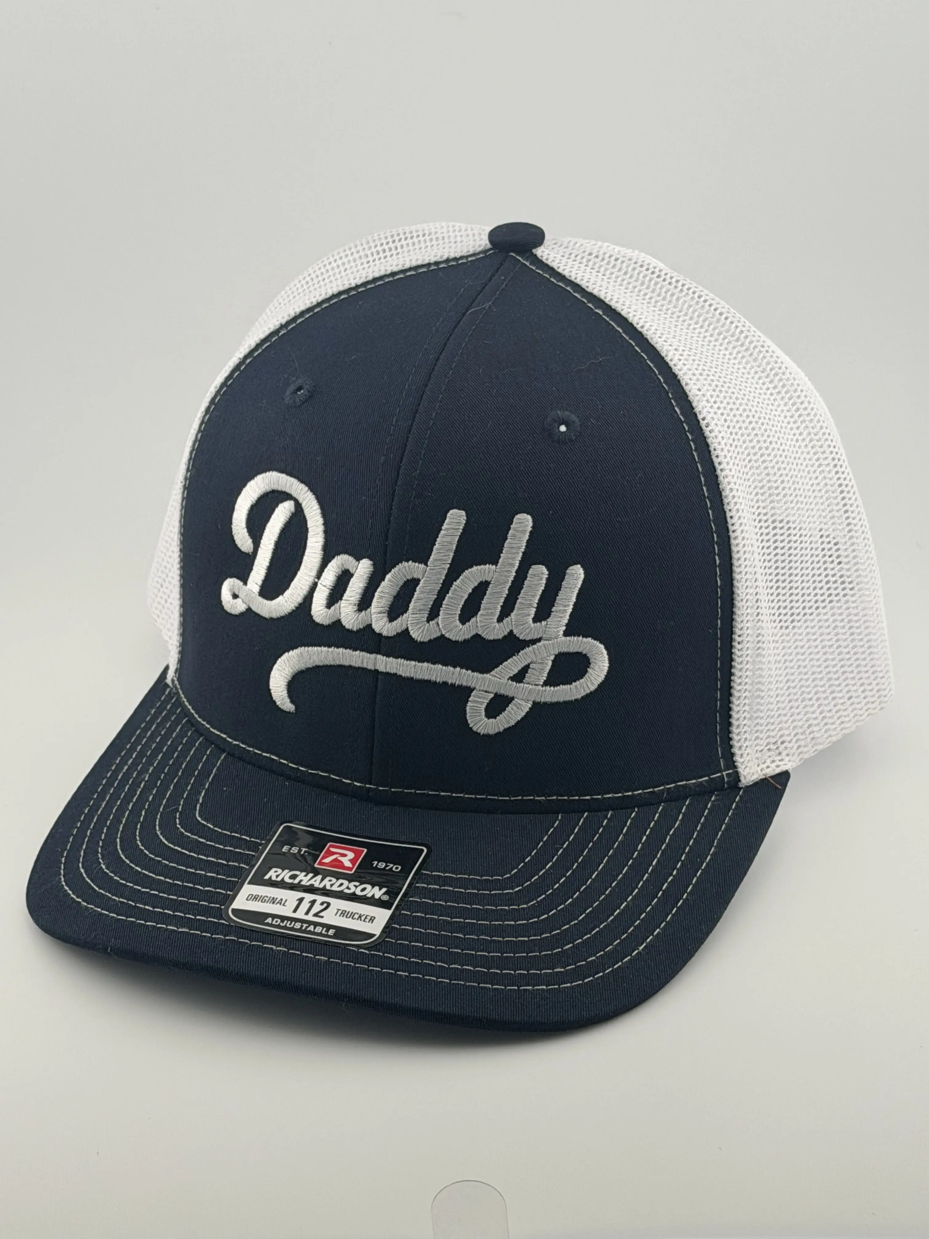 Richardson 112 Unisex Daddy Snapback Hat, Navy Fabric with Bold White Script Embroidery, Breathable Sides, Flat Brim, Playful Fashion Accessory, Embroidered Baseball Cap, Funny Dad Hat Premium Fitted Cap, Daddy Embroidery Hats, Front Letter Hats