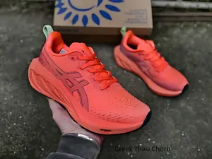 Bright fiery orange mesh running trainers with sculpted thick gradient cushion midsoles