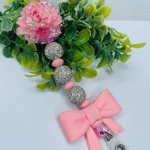 Pink Flower Badge Reels with Sparkling Beads and Bow Charm for Stylish Identification