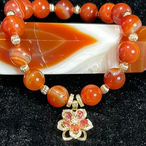 Sardonyx bracelet with spinning flower pendant