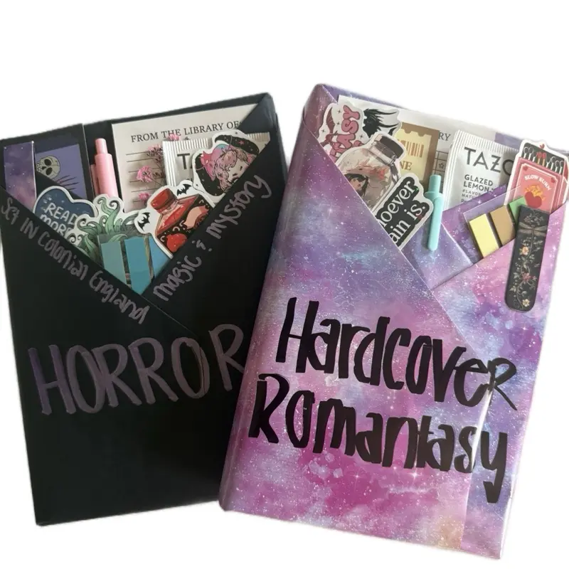 Double Blind Date with a Book – Premium Package includes colorful page tabs, a handcrafted tea blend, fun stickers, a reading tracker, a stylish bookmark, and a vibrant colored pen for the ultimate cozy reading experience.