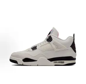 White, black, and red leather mid-top basketball shoes, with a white leather upper, a visible air-cushion sole for shock absorption, and a mid-top design that combines retro style with athletic performanc