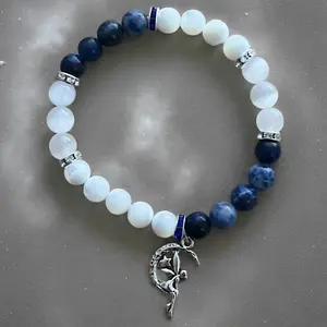 Intuition, Clarity & Spiritual Connection Stretchy Bracelet. Mother of Pearl Shell, Sodalite & Selenite 8 mm bead stretchy bracelet with clear and blue cz spacers with fairy charm or no charm. Crystal Fashionable Jewelry