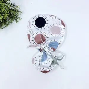 Navy & Coral Suns Ponytail scrub cap for women with satin lined option by Paradise Caps.