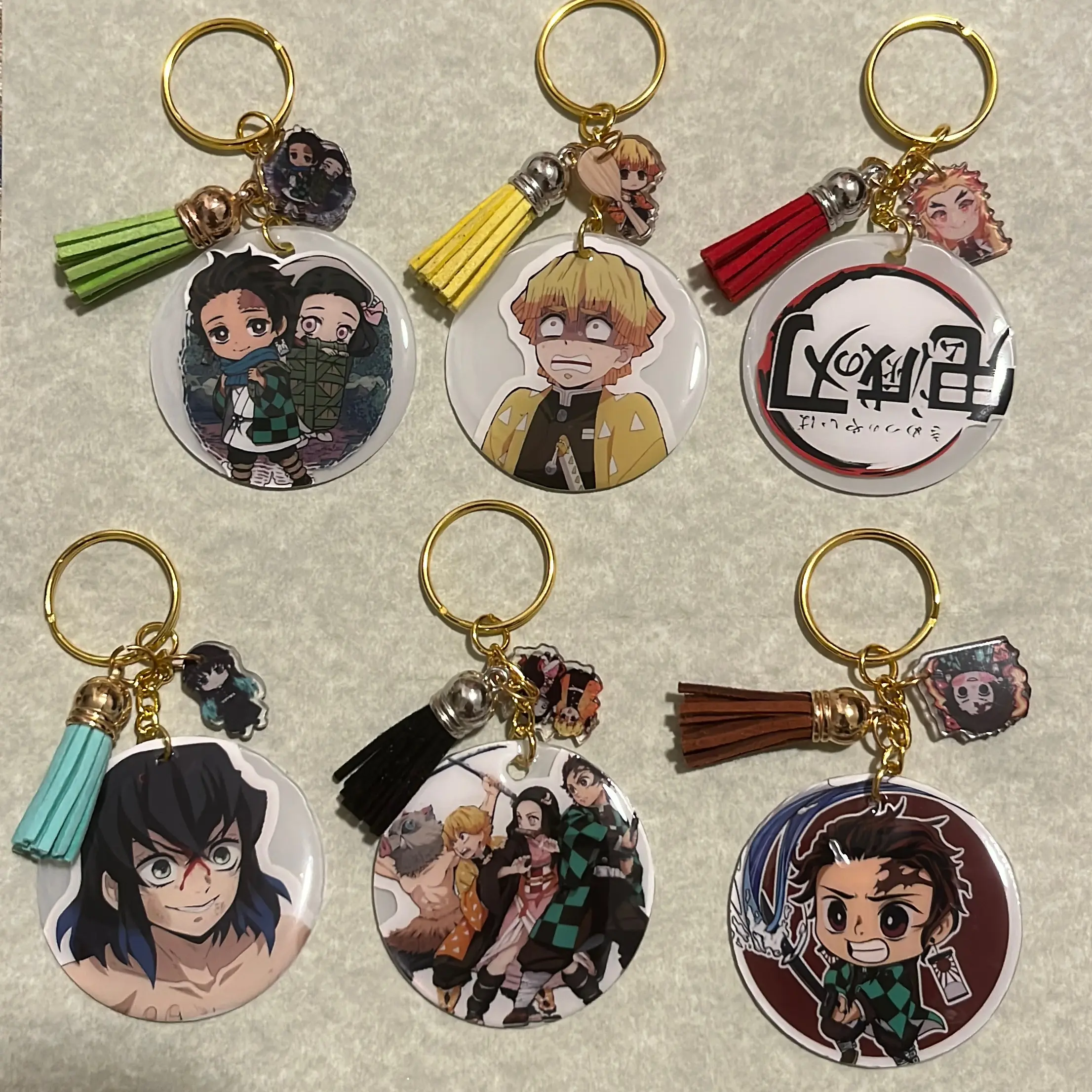 Resin sealed acrylic Demon slayer keychain with tassel