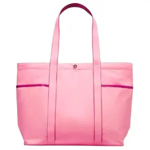 Lululemon Daily 20L Tote Bag for Women with Multiple Pockets and Snap Closure in Nylon, Ideal for Commuting and Shopping in Blossom Pink and Washed Purple.