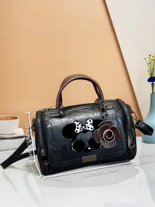 Vintage Boston shoulder bag, handbag with a floral pendant and a black and white Minnie Mouse head wearing sunglasses, perfect for gifting to mothers and friends, a top choice for Valentine's Day gifts.