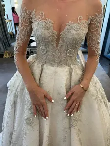 C2022-SLS009 - Sheer illusion neckline long sleeve beaded wedding ball gown