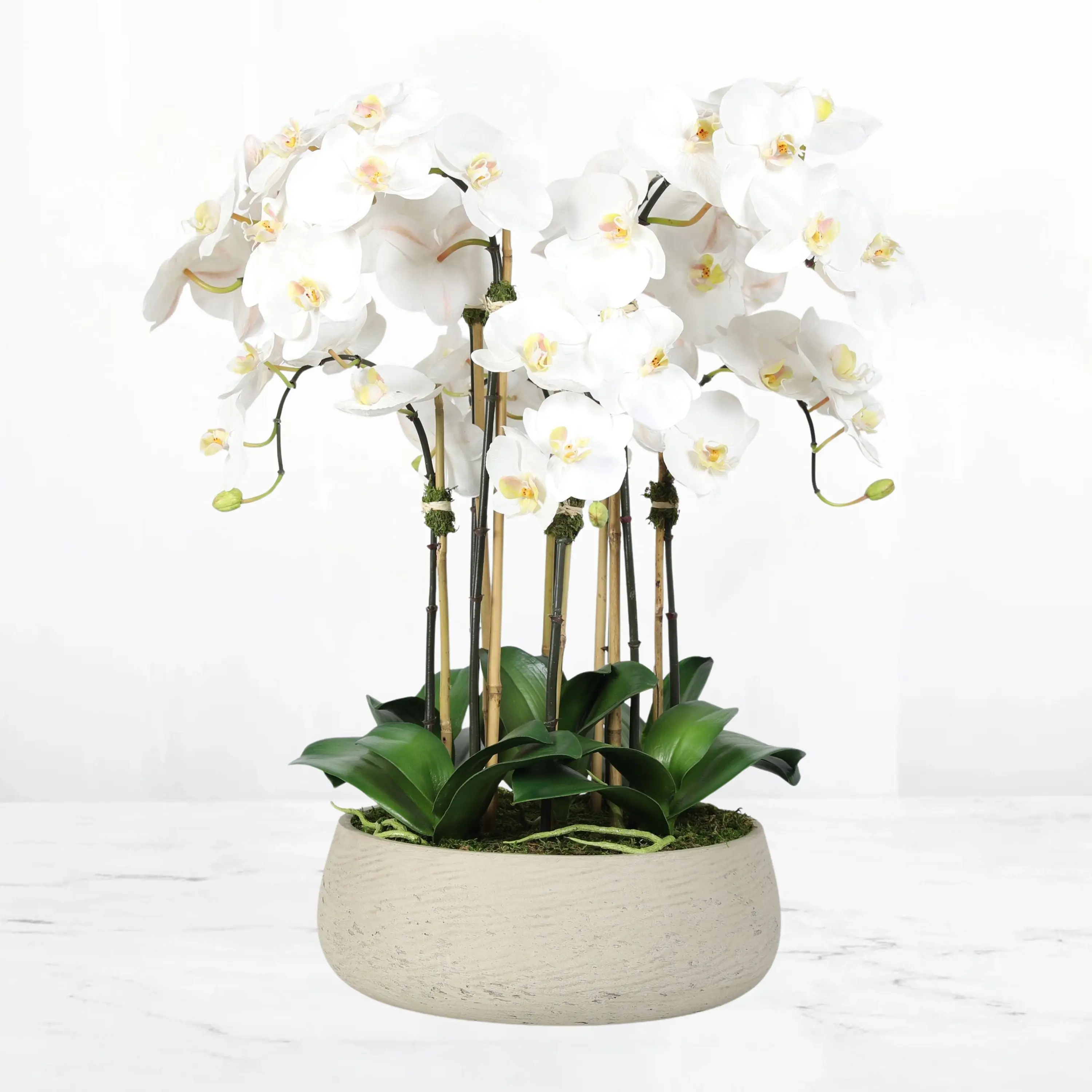 Artificial orchid centerpiece arrangement in beige planter - 28"