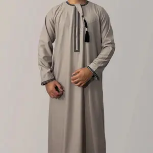 New solid color round neck embroidered thick tassel Oman dress Saudi Arabian men's long sleeved robe transparent fabric Muslim dignified formal attire