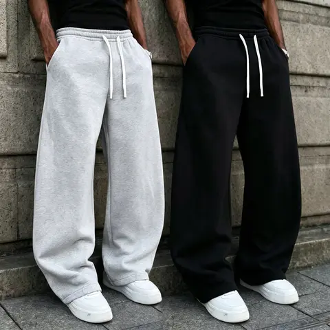 Men’s loose cotton–polyester athletic pants — American high-street style full-length casual joggers with an elastic drawstring waistband, a relaxed, drapey fit, skin-friendly fabric, solid color design, suitable for everyday wear.