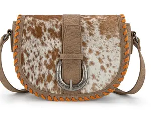 TRINITY RANCH COWHIDE SADDLE CROSSBODY BAG