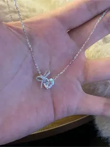 A Beautiful and Elegant Heart-shaped Cubic Zirconia Pendant Necklace, A Bow Necklace, A Heart-shaped Silver Chain Necklace, for Ladies. Suitable for Daily Wear. A Gift for Valentine's Day and Mother's Day. Ladies' Jewelry Necklace.
