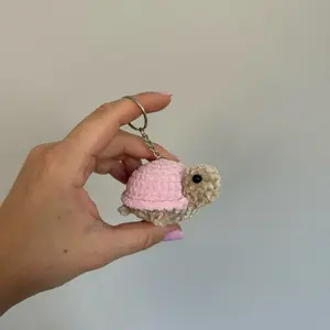 Handmade Crochet Keychain Featuring a Turtle with Pink Shell and Detailed Features for Unique Accessory