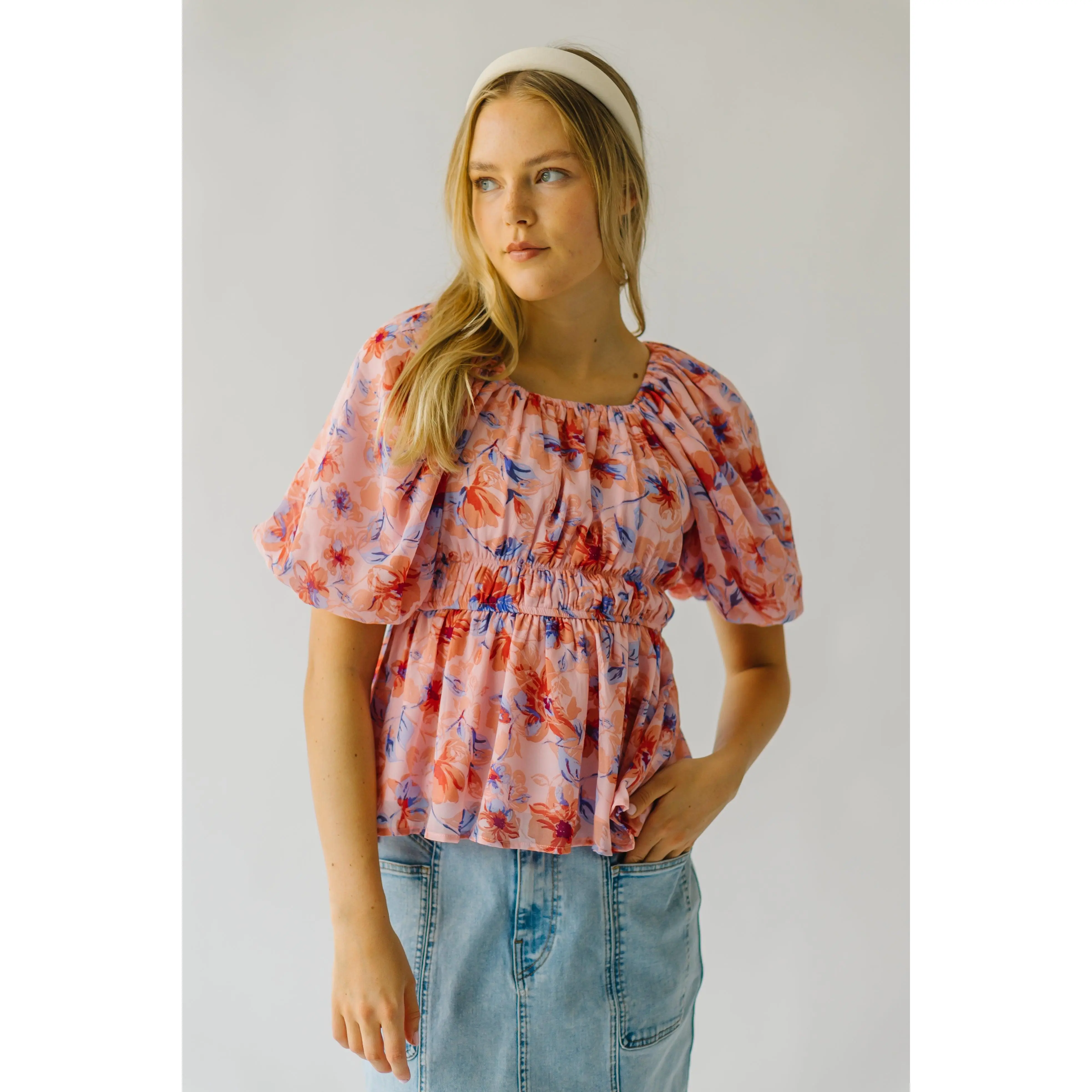 The Kinsella Floral Peplum Blouse in Peach Multi
