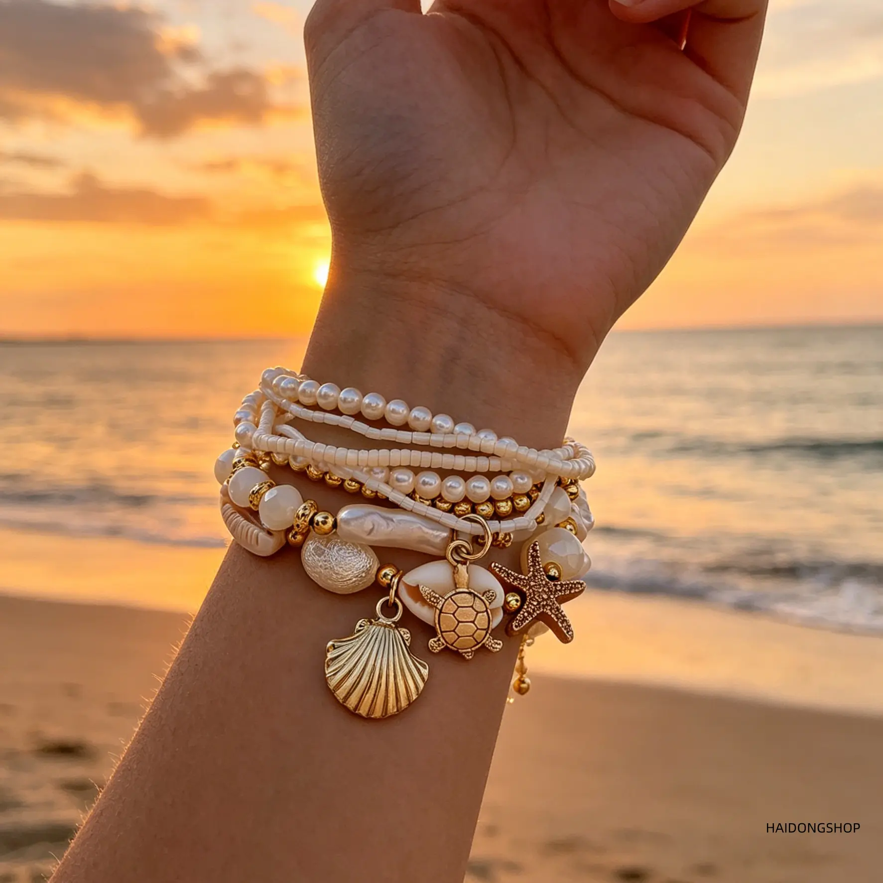 Women’s stackable bracelet set—handmade boho coastal shell and starfish wrist jewelry with faux pearls; an exquisite, trendy layered beach accessory that’s versatile for summer beach vacations, pool parties, and everyday casual outfits.