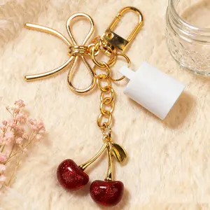 Gold Bow Cherry Lip Gloss Holder Keychain for Summer Fridays 0.5oz | Leak-Proof Protective Cap Bag Charm with Sparkling Red Cherries | Elegant Gift for Beauty Lovers