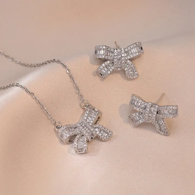 A women's bow-themed jewelry set featuring a sweet and elegant style; crafted from silver, it makes an ideal gift and is perfect for weddings.