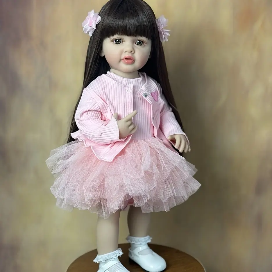 22" Single Nora Reborn Girl Doll - Handcrafted Vinyl Doll with Long Hair, Hand-Painted Details, Pink Dress & Coat, Washable Soft Feel - Perfect for Birthday Surprise & Christmas Gifts