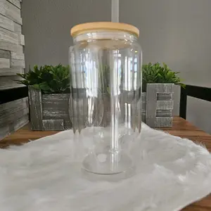 Customized 16 oz snow globe glass cup includes wrap, bamboo lid and glass straw.