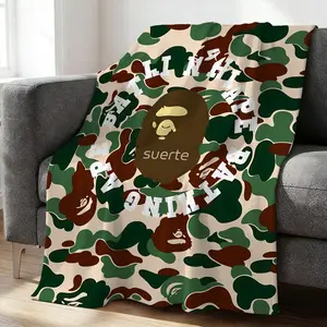 Camo Suerte Blanket, Stylish Flannel Blanket with Iconic Ape Head Design, Perfect for Home Decor, Camping Adventures, and Office Warmth, Unique Addition to Your Collection!