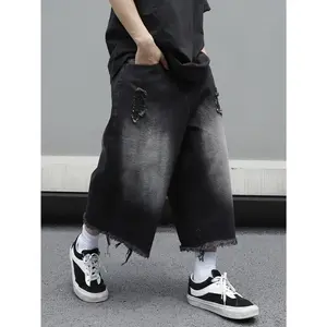 Oversized loose-fit denim shorts (jorts) with pocket insertion and a frayed hem — plain, long, suitable for parties and street wear