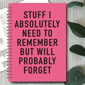 A spiral notebook with the cover quote Things I Need to Remember (But Might Forget Pink cover with black text, ideal for office or school supplies Perfect gift for colleagues, workstation accessory Fun design, durable binding Planner