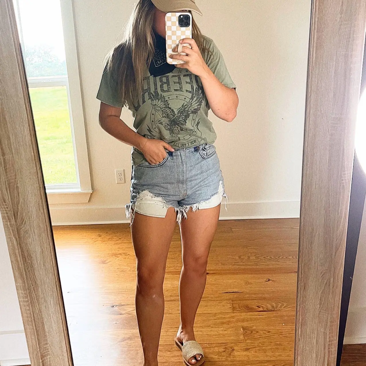 Graphic tee + Levi shorts + bandana + trucker hat + woven sandals