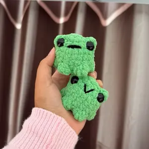 Handmade crochet green pocket frog plushie