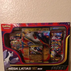 Pokemon Mega Latias EX Box - Inclues one regular size card 1 mega card and four booster mega evolution packs with rare cards in them