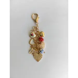 PORCELAIN BOWS HEARTS PEARL STRAWBERRY BAG CHARM