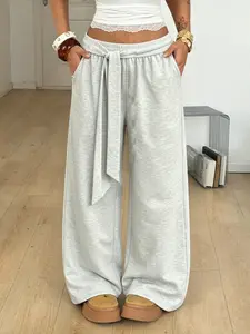 Women’s casual athletic pants, wide-leg design, drawstring elastic cuffs, street-style textured cotton, high-waisted wide fit, waist tie detail, floor-length, relaxed casual vibe, suitable for everyday outings and streetwear looks, no holiday/special occa