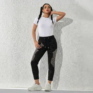 Shine with every step!  Rhinestone Wing & Fleur-de-lis Camo Joggers.