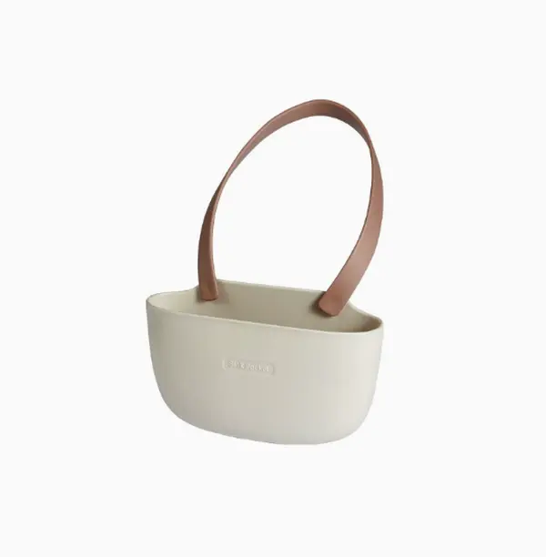 his minimalist tote with curved handle and matte finish pairs perfectly with casual shorts for a clean, modern look whether you’re heading to the farmers market or grabbing coffee downtown.