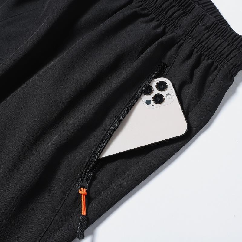 Men’s quick-dry casual athletic shorts featuring an elastic drawstring waist and zippered pockets on both sides, suitable for summer wear—ideal for outdoor sports, fitness, jogging, cycling, and basketball.