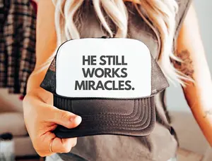 He Still Works Miracles Trucker Hat